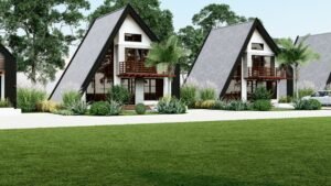 Two A-frame houses with lush greenery and a scenic view.