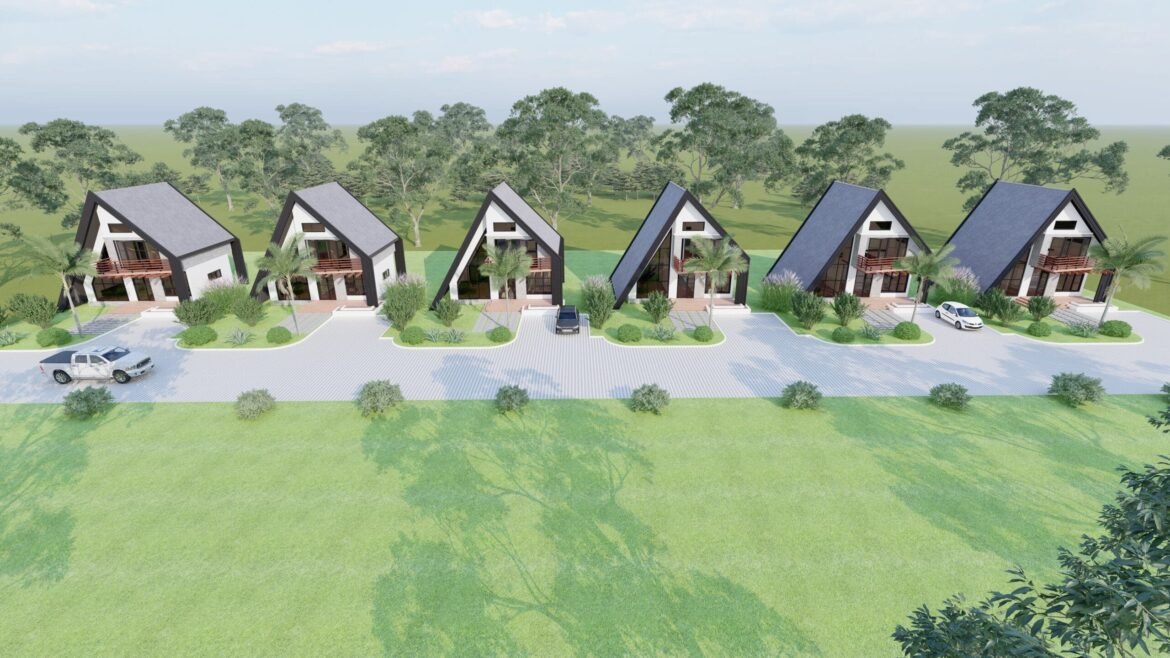 Aerial view of modern houses surrounded by greenery.