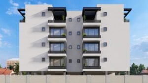 Contemporary apartment building with balconies and greenery.
