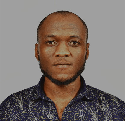 Portrait Male A serious male portrait with short hair and patterned shirt.