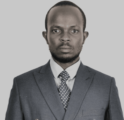 Professional Headshot Man Suit Man in a suit with a serious expression on grey background.