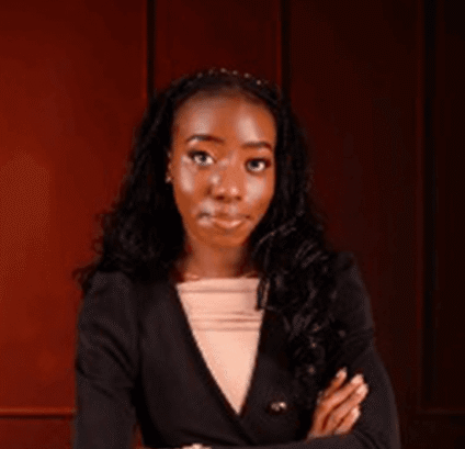 Professional Portrait Confident Woman A confident woman in a black blazer poses thoughtfully.