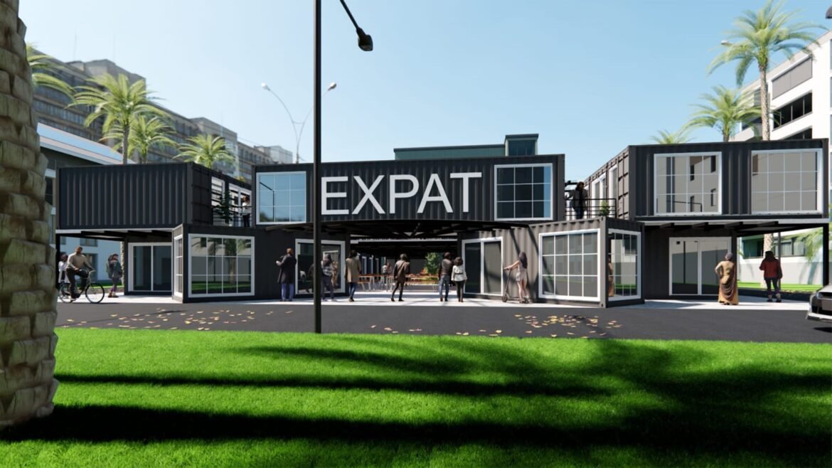 Modern building featuring the word 'EXPAT' in large letters.