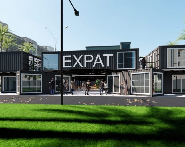 Modern building featuring the word 'EXPAT' in large letters.