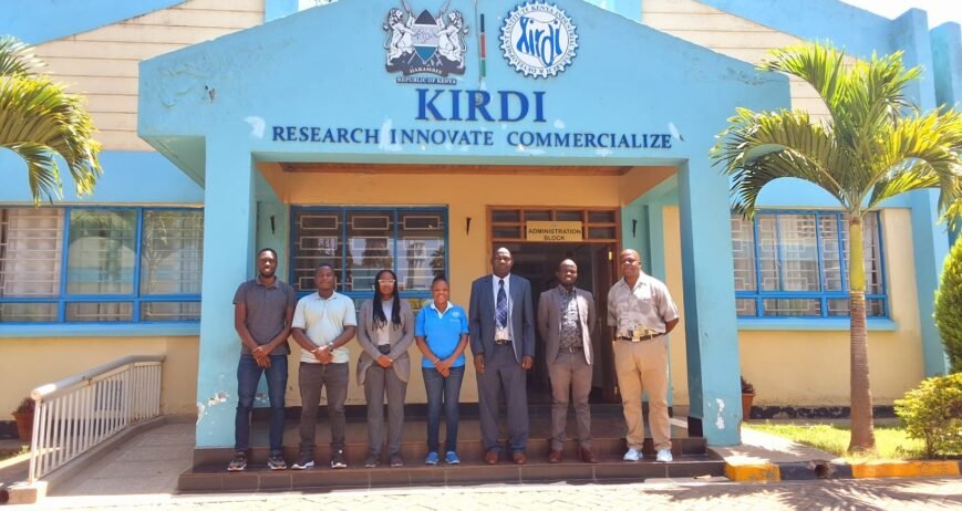 Group of individuals in front of KIRDI building in Kenya.