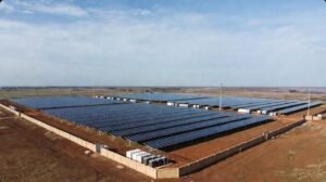 Aerial view of a large solar farm with solar panels.