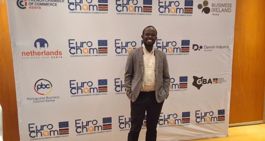 Person standing at EuroCham event backdrop in Kenya.