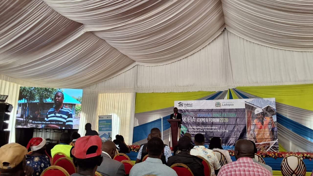 People attending a housing innovation forum event.