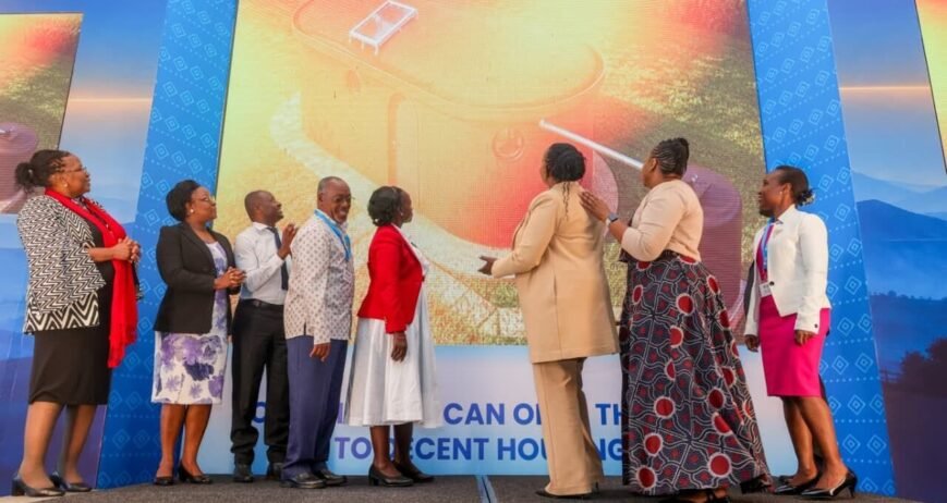 Group of people unveiling a housing initiative presentation.