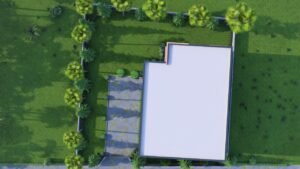 Aerial view of a modern house surrounded by greenery.