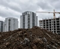 New apartment buildings under construction with a crane.