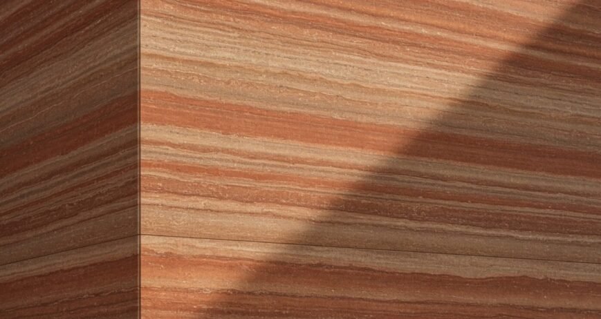 Rammed Earth Wall Surface Close-up of a finished rammed earth wall with layered patterns.